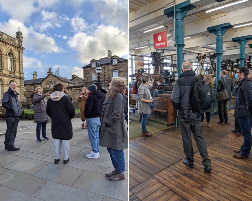 Two images of groups of people from the conference having a tour of Saltaire and the Bradford Industrial Museum. On the left a group stands around Maggie, our guide speaking about the layout of the town. On the right, members of the group are surrounded by the working machines salvaged from industrial mills. 