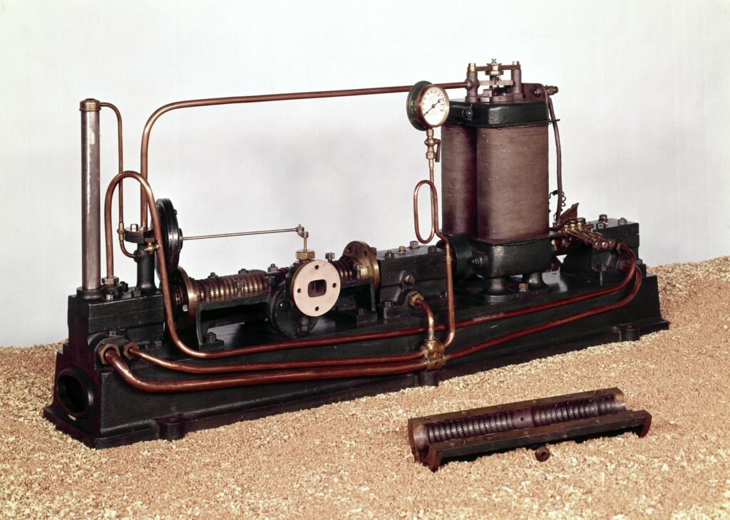 A Parsons' steam turbine generator laid out on a surface.